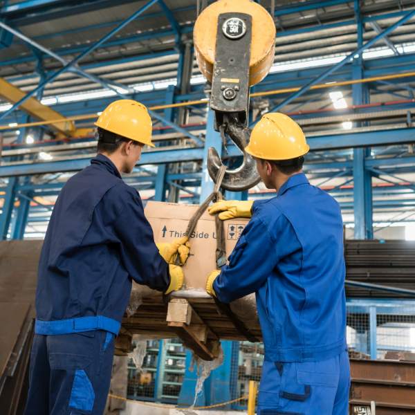 Employee practicing safe lifting as part of HSEQ manual handling training for injury prevention and workplace compliance.