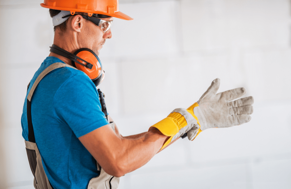 Workers engaged in behavioral safety, identifying hazards, and reinforcing HSEQ principles in a vocational training environment.