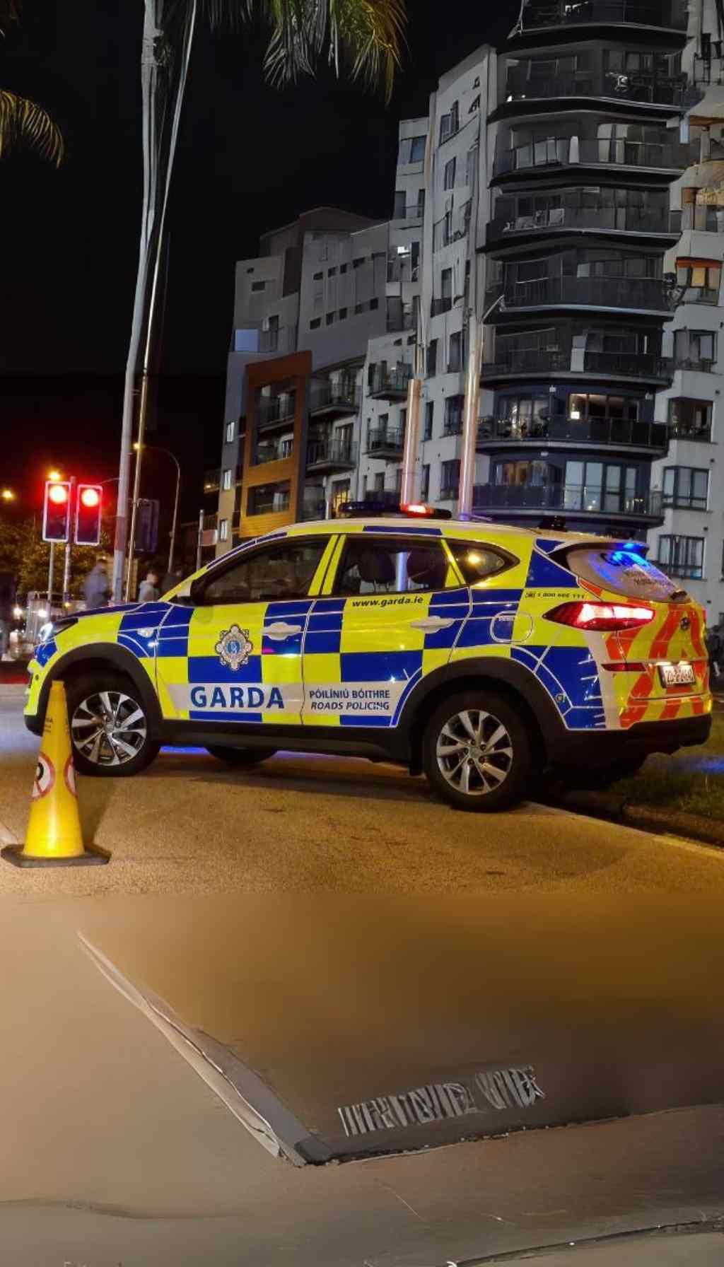 Marked Garda Roads Policing vehicle at night with flashing lights, symbolising Ireland’s investment in reliable emergency communications to support frontline services.